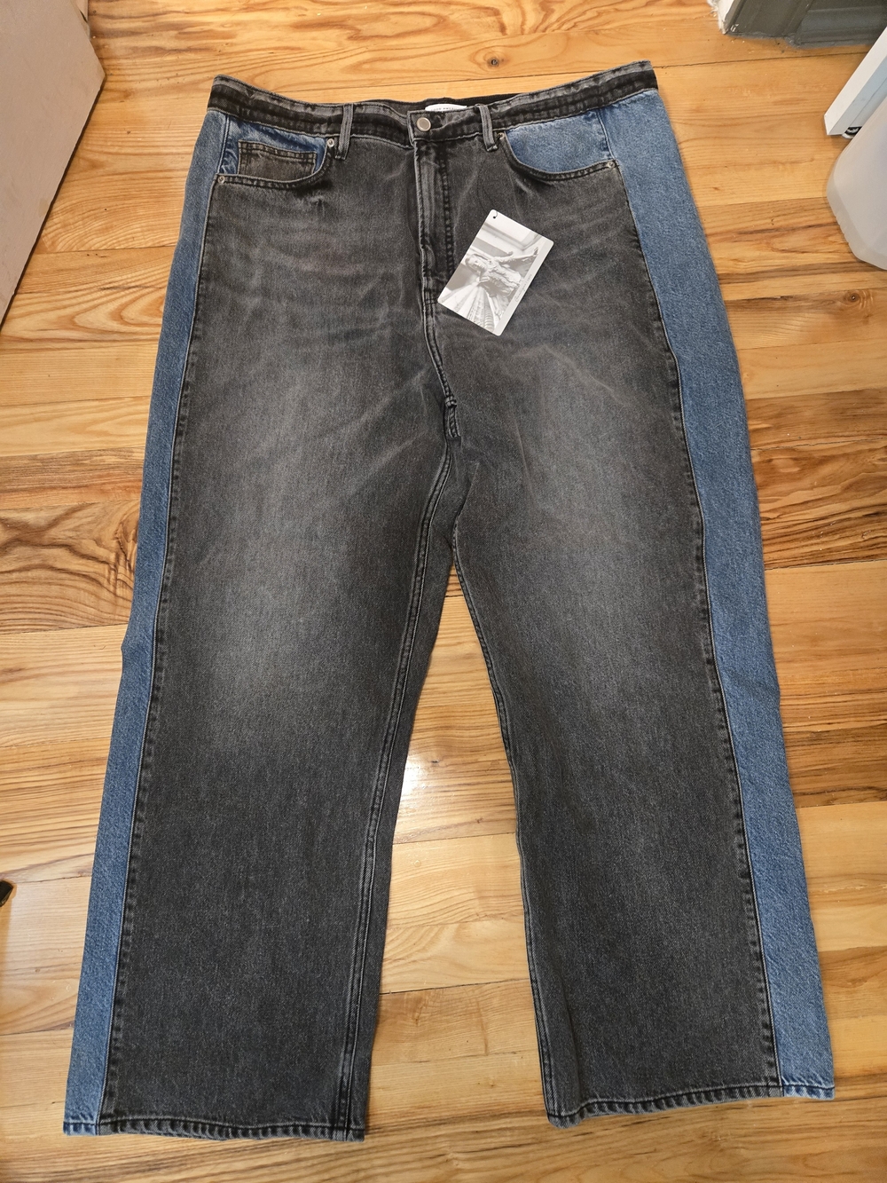 Good American Two-Tone Black and Blue Straight-Leg Jeans